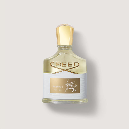 Frasco de perfume Creed Aventus for her con tapón dorado