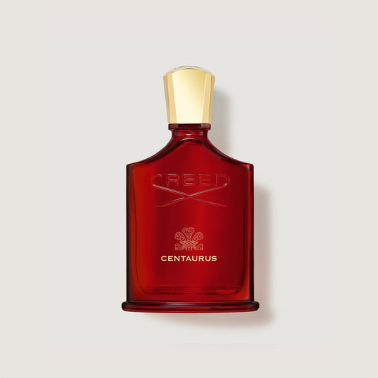 Frasco rojo de perfume Creed Centaurus con tapón dorado