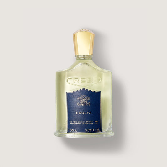 Frasco de perfume Creed Erolfa de 100 ml en un fondo beige claro
