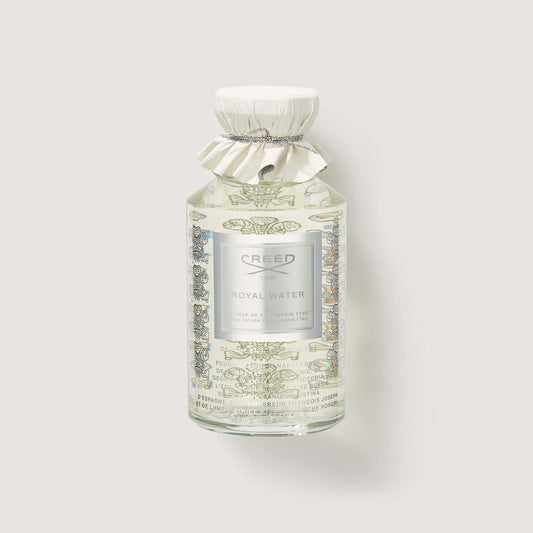 Frasco de perfume Creed Royal Water de 100 ml en un fondo beige claro.