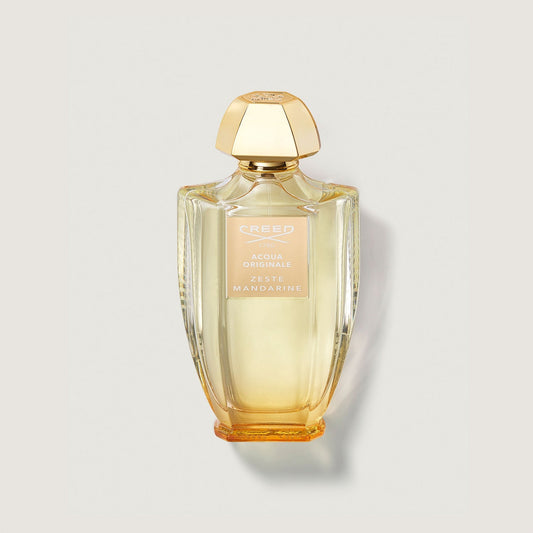 Frasco de perfume Creed Zeste Mandarine de 100 ml en un fondo beige claro.